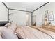 The bedroom has a four-poster bed, stylish decor, and plenty of natural light at 7350 N Decatur Blvd # 5, Las Vegas, NV 89131