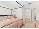 A beautifully staged bedroom has a modern bed frame and an en suite bathroom at 7350 N Decatur Blvd # 5, Las Vegas, NV 89131
