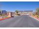 Gated community entrance featuring brick pillars, decorative wrought iron, and well-maintained landscaping at 7350 N Decatur Blvd # 5, Las Vegas, NV 89131