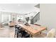Open-concept dining room with hardwood floors and adjacent living room, perfect for entertaining at 7350 N Decatur Blvd # 5, Las Vegas, NV 89131