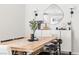 Bright dining room features a stylish table with black chairs, sconce lighting, and trendy decor at 7350 N Decatur Blvd # 5, Las Vegas, NV 89131