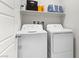 Functional laundry room with white washer and dryer at 7350 N Decatur Blvd # 5, Las Vegas, NV 89131