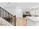 Bright living space featuring wood floors, modern decor, and easy kitchen access at 7350 N Decatur Blvd # 5, Las Vegas, NV 89131