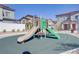 Community playground with slides and soft surface, providing a safe and fun play area at 7350 N Decatur Blvd # 5, Las Vegas, NV 89131
