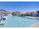 Community pool with lounge chairs and covered seating areas, perfect for relaxing and socializing at 7350 N Decatur Blvd # 5, Las Vegas, NV 89131
