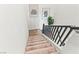 Carpeted staircase with black railing and white walls, enhanced by modern Matisse wall art decor at 7350 N Decatur Blvd # 5, Las Vegas, NV 89131