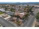 Aerial view showcases the single-story home, desert landscaping, terracotta roof, and neighborhood at 800 Kenny Way, Las Vegas, NV 89107