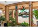 View from indoors of the beautiful backyard pool surrounded by desert landscaping at 800 Kenny Way, Las Vegas, NV 89107