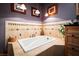 Bathroom with large soaking tub, tile surround, and custom cabinetry at 800 Kenny Way, Las Vegas, NV 89107