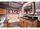 Bathroom featuring a soaking tub, wood vanity and neutral color palette at 800 Kenny Way, Las Vegas, NV 89107