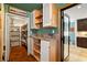 Butler's pantry with tile floors and countertops, and a large walk-in pantry with shelving and ample storage space at 800 Kenny Way, Las Vegas, NV 89107