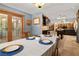 Spacious dining room open to the kitchen featuring wood floors and neutral paint at 800 Kenny Way, Las Vegas, NV 89107