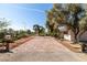 Extra wide brick driveway leading to this home features beautiful desert landscaping at 800 Kenny Way, Las Vegas, NV 89107