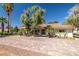 Charming single-story home featuring mature trees, desert landscaping and a brick paved driveway at 800 Kenny Way, Las Vegas, NV 89107