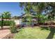 Charming backyard gazebo surrounded by green lawn and mature trees, perfect for relaxation and outdoor gatherings at 800 Kenny Way, Las Vegas, NV 89107