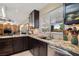 Modern kitchen with granite counters, stainless steel appliances and ample cabinetry at 800 Kenny Way, Las Vegas, NV 89107