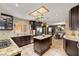 Bright kitchen features granite countertops, an island, stainless steel appliances, and modern finishes at 800 Kenny Way, Las Vegas, NV 89107