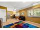 Inviting living room features a colorful rug, wood floors, and natural light with ample space for entertaining at 800 Kenny Way, Las Vegas, NV 89107