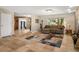 Spacious living room with tile floors, a large window and cozy furniture at 800 Kenny Way, Las Vegas, NV 89107