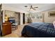 Comfortable main bedroom featuring wood floors, closet with mirrored doors, and a large window at 800 Kenny Way, Las Vegas, NV 89107