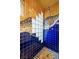 Close up of tiled shower with glass block and blue mosaic tiles at 800 Kenny Way, Las Vegas, NV 89107