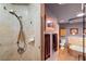 Shower with glass door, tile surround and modern shower head at 800 Kenny Way, Las Vegas, NV 89107