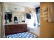 This is a bathroom featuring a double sink vanity, bathtub, shower, with blue and white accents at 8122 Retriever Ave, Las Vegas, NV 89147