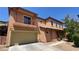 Attractive two-story home showcasing a covered entry, balcony, and a two-car garage with low maintenance landscaping at 8122 Retriever Ave, Las Vegas, NV 89147