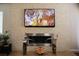 Close up view of a contemporary fireplace with a stone accent wall and a mounted flat-screen television at 8122 Retriever Ave, Las Vegas, NV 89147