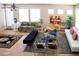 Open-concept living area with tile floors, neutral walls, and ample natural light from large windows at 8122 Retriever Ave, Las Vegas, NV 89147