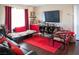 Cozy living room featuring a comfortable seating area and a large-screen television for entertainment at 8122 Retriever Ave, Las Vegas, NV 89147
