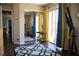 Room featuring fitness equipment, a sliding glass door with a balcony, a keyboard, and dark floors at 8122 Retriever Ave, Las Vegas, NV 89147