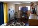 This is a bright room with fitness equipment, a keyboard, and a blue and yellow curtain at 8122 Retriever Ave, Las Vegas, NV 89147