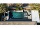 Aerial view of backyard pool and spa with outdoor kitchen and lounge area at 8514 Garnet Lake Ave, Las Vegas, NV 89113