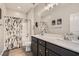 Bathroom with double vanity, modern lighting, and shower/tub combo at 8514 Garnet Lake Ave, Las Vegas, NV 89113