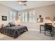 Comfortable bedroom with carpet, ceiling fan, and bright windows at 8514 Garnet Lake Ave, Las Vegas, NV 89113