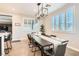 Charming dining area featuring bright windows, modern lighting, and stylish decor at 8514 Garnet Lake Ave, Las Vegas, NV 89113