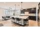 Bright kitchen with a large island, sleek countertops, and views to a dining area at 8514 Garnet Lake Ave, Las Vegas, NV 89113