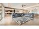 Spacious living room with plush seating, modern decor, and seamless access to the kitchen at 8514 Garnet Lake Ave, Las Vegas, NV 89113