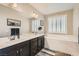 Main bathroom with double sinks, soaking tub, and stylish fixtures at 8514 Garnet Lake Ave, Las Vegas, NV 89113