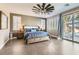 Relaxing main bedroom with a king bed, ceiling fan, and sliding glass door to the backyard at 8514 Garnet Lake Ave, Las Vegas, NV 89113