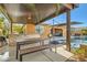 Covered outdoor kitchen and dining area create a perfect space for entertaining by the pool at 8514 Garnet Lake Ave, Las Vegas, NV 89113
