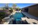 Backyard pool and spa offer a refreshing escape with desert landscaping and outdoor lounge areas at 8514 Garnet Lake Ave, Las Vegas, NV 89113