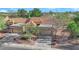 Stunning aerial view of the desert home featuring a tile roof and mature landscaping at 9013 Litchfield Ave, Las Vegas, NV 89134