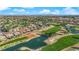 Expansive aerial view of a lush golf course community with stunning water features and panoramic city views at 9013 Litchfield Ave, Las Vegas, NV 89134