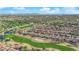 Breathtaking aerial view of a golf community with scenic landscapes and a vibrant residential neighborhood at 9013 Litchfield Ave, Las Vegas, NV 89134
