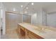 Bathroom featuring double sinks, shower, and warm lighting at 9013 Litchfield Ave, Las Vegas, NV 89134
