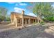 Exterior of a home featuring desert landscaping, tile roof, and a covered front porch at 9013 Litchfield Ave, Las Vegas, NV 89134
