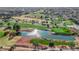 Aerial view of a golf course with greens, water features, trees, and cart paths winding throughout the course at 9013 Litchfield Ave, Las Vegas, NV 89134