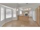 Bright kitchen and dining area with tile floors and natural light from windows at 9013 Litchfield Ave, Las Vegas, NV 89134